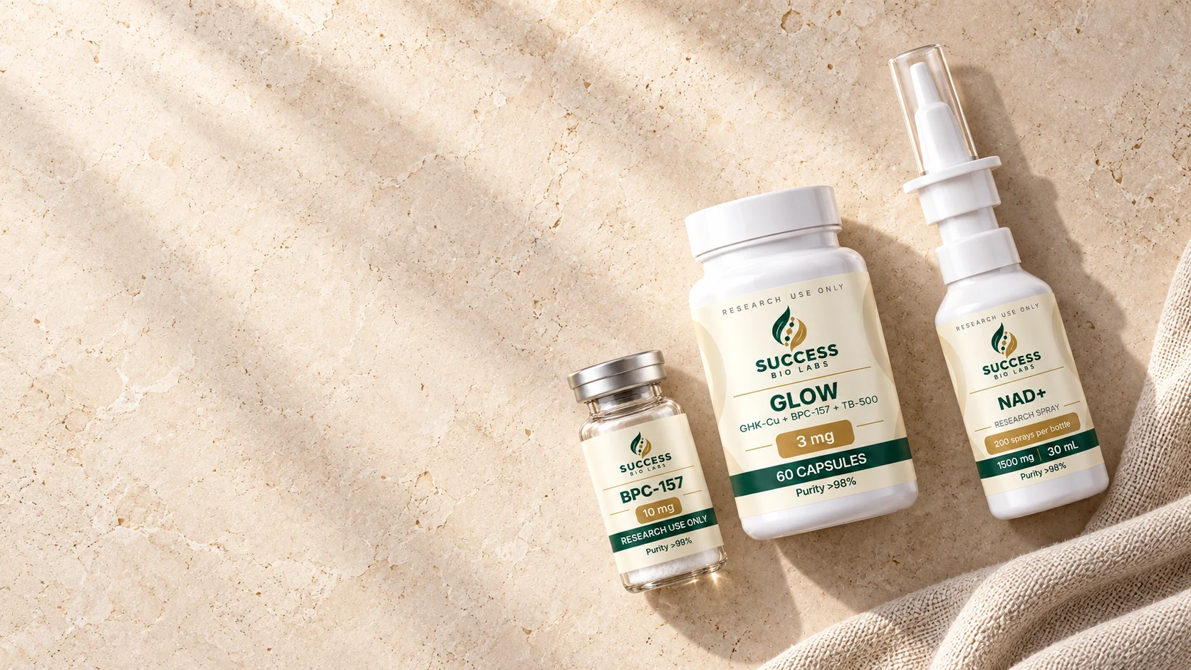 Success Bio Labs vial, capsules and spray arranged on sunlit natural stone and linen
